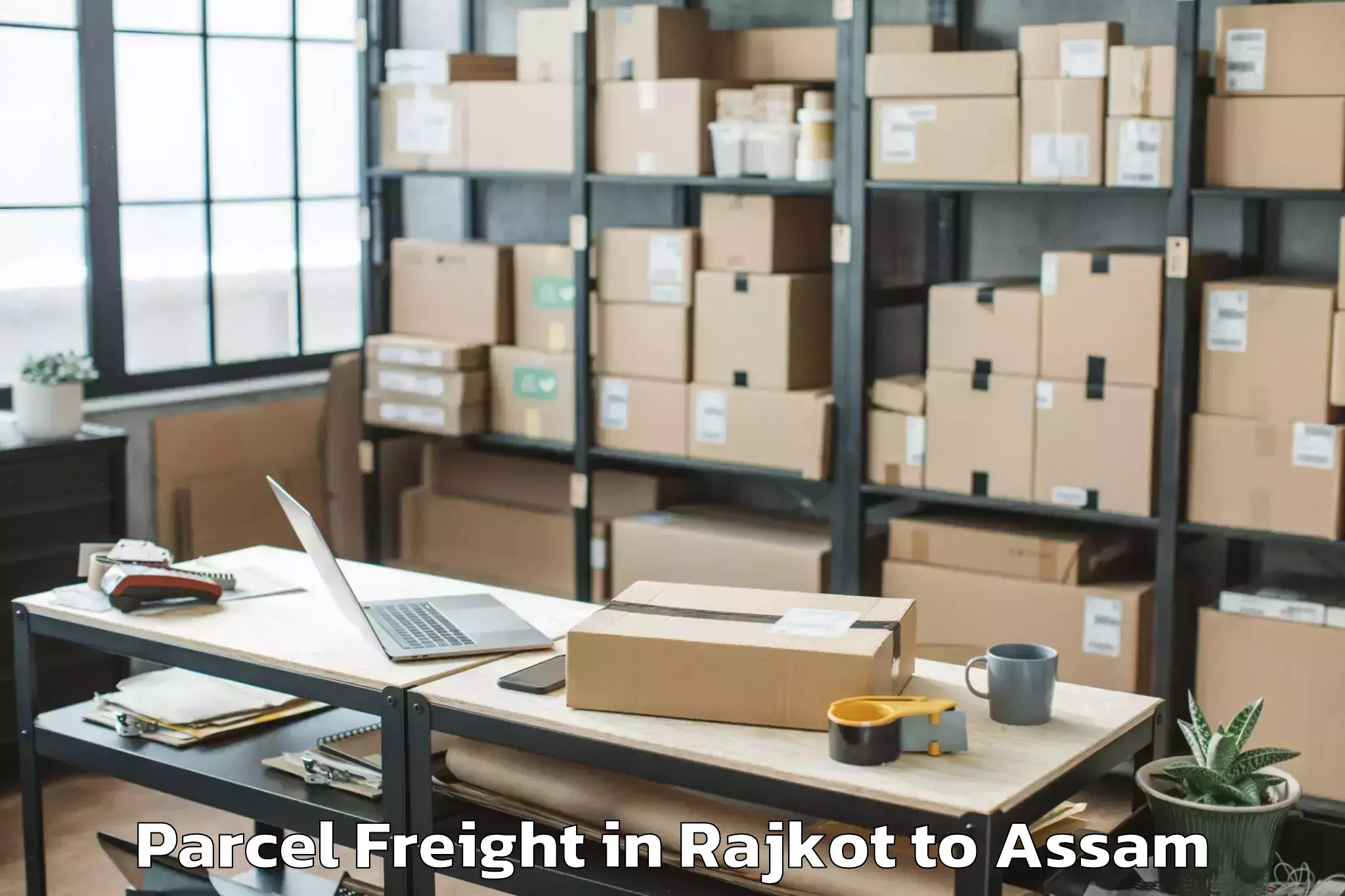 Book Rajkot to Bogribari Parcel Freight Online